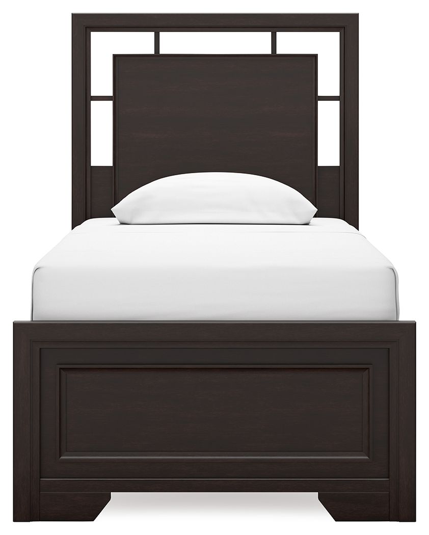 Single bed with a dark wood frame and a white mattress, featuring a simple, modern headboard.