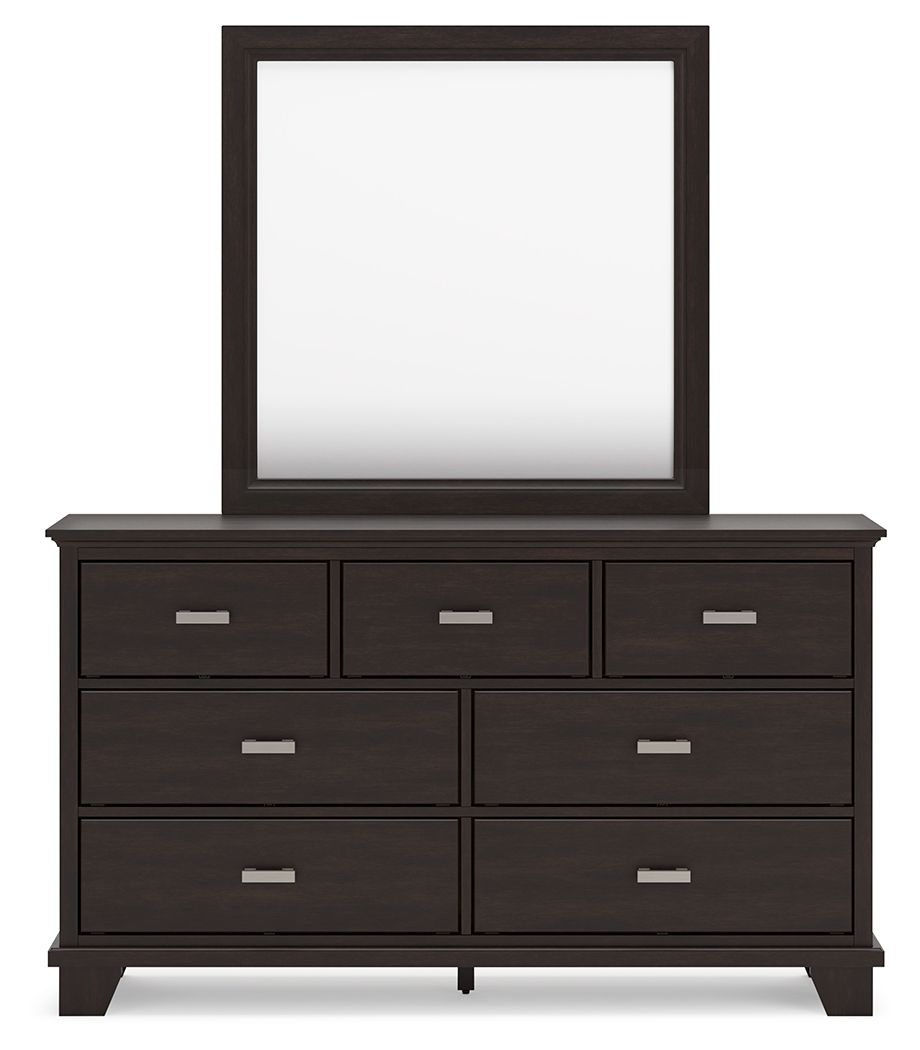 Dark wood dresser with seven drawers and a rectangular mirror above.